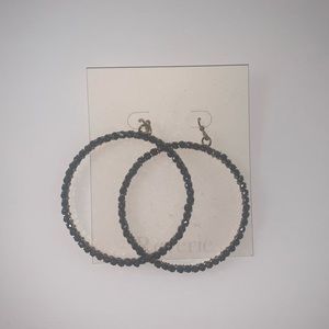 Brand new silver studded hoop earring